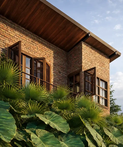 Residência contemporânea com paredes de tijolinho aparente e telhado cerâmico.